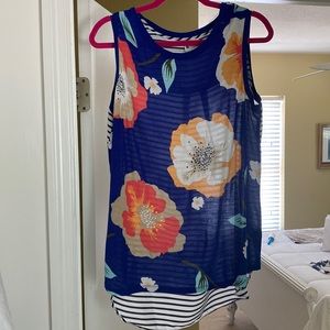 Sleeveless blouse, flowers front, stripes back. Size large, longer in back.